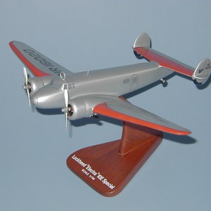 Lockheed L-10 Electra benutzt von Amelia Earhart Flugzeugmodell handgeschnitzte Mahagoniholznachbildung Tischaufsteller