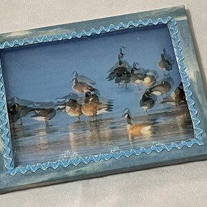 Framed Art - Geese on Water & Ice. Double layer photograph creates a 3-Dimensional Holographic look. Framed. Ready to hang.