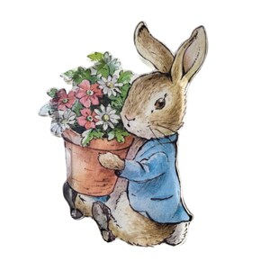May include: A watercolor illustration of a rabbit in a blue jacket, holding a terracotta pot filled with pink and white flowers. The rabbit has brown fur and long ears, and the image is set against a white background.