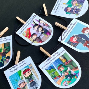 May include: A set of 6 illustrated cards with a black string and clothes pegs. Each card features a different scene of people in traditional clothing, with text that reads "We Honor You By: " followed by a phrase describing the scene. The phrases are "Serving Your Guests", "Beating our Chests in Sadness", "Crying for Your Tragedies", "Getting Ready to Attend Your Majles", "Clothing our Homes in Black", and "We Honor You By: "