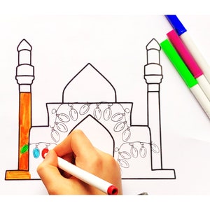 May include: A black and white line drawing of a mosque with a string of lights around the archway. A hand is holding a white marker and is coloring in the lights.