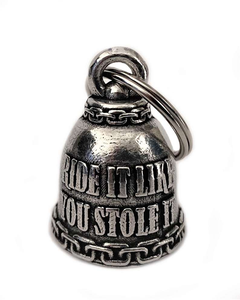 May include: Silver motorcycle handlebar bell with a chain detail and the inscription "Ride it like you stole it".