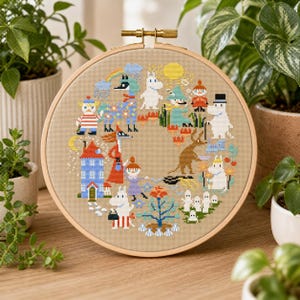 May include: A cross-stitch embroidery hoop featuring a colorful cartoon scene with various characters, a rainbow, and a sun. The design is stitched on tan fabric and framed in a wooden hoop. The scene includes a house, trees, and other whimsical elements.