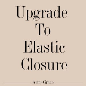 May include: A beige background with the words "Upgrade To Elastic Closure" in a black, elegant font. The text "Arte+Grace" is at the bottom in a smaller font.