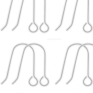 May include: A set of eight silver earring hooks. The hooks are made of metal and have a loop at the top and a small ball at the bottom.