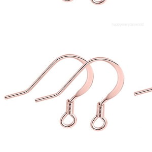 May include: Eight rose gold earring hooks. The hooks are made of metal and have a simple design. They are perfect for making earrings.