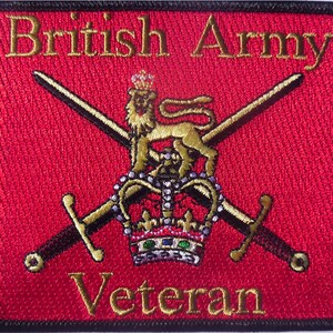 May include: A red embroidered patch with a gold lion, crown, and crossed swords. The text "British Army Veteran" is embroidered in gold.