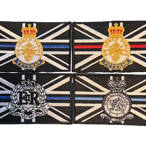 May include: Four embroidered patches with a Union Jack design. Each patch features a different crest, including the Armed Forces Veteran crest, the Royal Military Police crest, and two other crests. The patches are black with white, red, and blue embroidery.