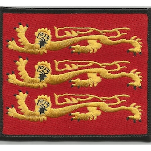 May include: A red embroidered patch with three gold lions on a red background. The lions are facing right and have black claws and faces.