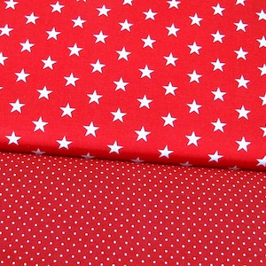 May include: Red fabric with a white star pattern on the top half and a white polka dot pattern on the bottom half.