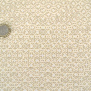 May include: White fabric with a repeating pattern of small, gold, interlocking circles.
