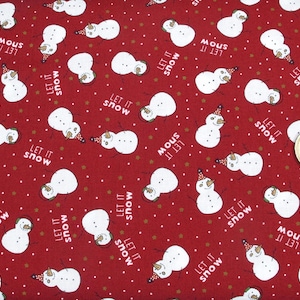 May include: Red fabric featuring a repeating pattern of white snowmen with party hats and the text "Let it snow." The design also includes small white and gold dots.