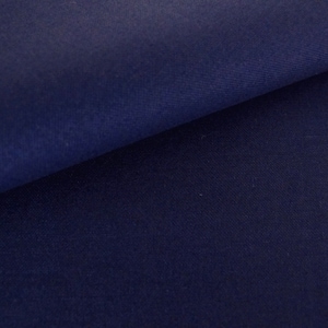 May include: A close-up of a dark blue fabric with a smooth texture.