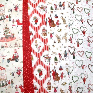 May include: A collection of four fabric panels featuring Christmas-themed illustrations. The patterns include a carousel, festive figures, red and white stripes with polka dots, musical characters, and green heart-shaped wreaths on white backgrounds.
