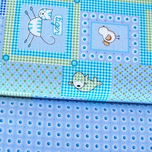 May include: Blue and green fabric with a patchwork design featuring various animal illustrations, including a cat, a bird, a hedgehog, and a seal. The fabric has a checkered pattern and a polka dot pattern.