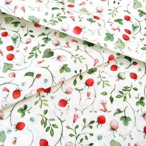 May include: White fabric with a repeating pattern of red berries, green leaves, and small white flowers.