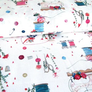 May include: White fabric with a repeating pattern of sewing-themed illustrations. The design includes spools of thread, sewing machines, scissors, buttons, thimbles, and floral accents in pink, blue, and green. Small red hearts are scattered throughout.