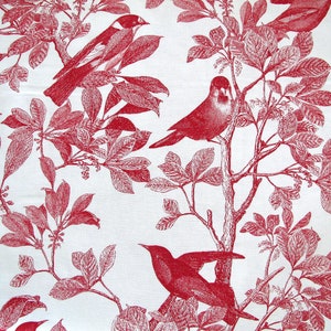 May include: Red and white fabric with a repeating pattern of birds and leaves. The birds are stylised and have a vintage look. The leaves are detailed and have a realistic look.