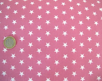 May include: Pink fabric with a white star pattern. The fabric is textured and has a subtle sheen. A Euro coin is included for scale.