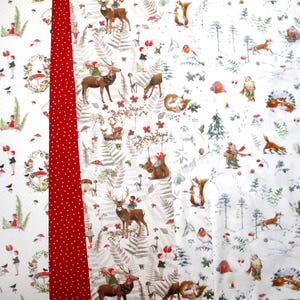 May include: A fabric panel featuring a vertical red strip with white polka dots separating sections of printed patterns. The designs include illustrations of deer, squirrels, foxes, birds, and small figures in a forest setting with trees and mushrooms.