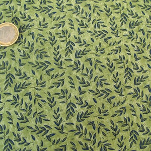May include: Green fabric with a repeating pattern of dark blue leaves. The fabric has a slightly textured surface.