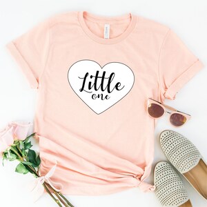 Little One Ddlg Shirt, - Super Soft 100% Cotton T-shirt With Short Sleeves and Crew Neckline in Soft Pink Color. Available sizes: XS, S, M, L, XL, 2XL, 3XL*.