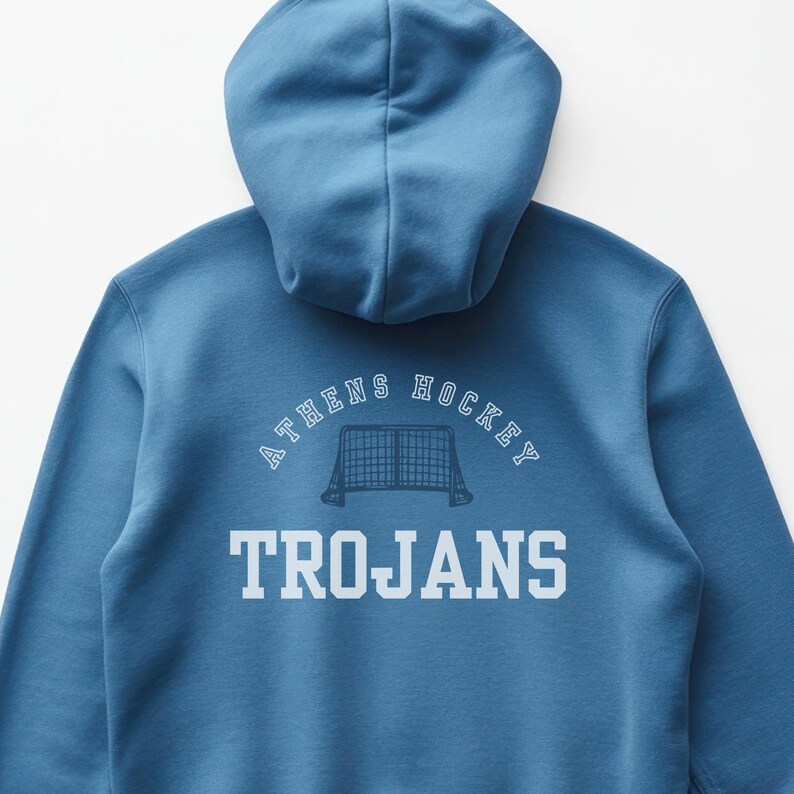 May include: A blue hooded sweatshirt with the text "ATHENS HOCKEY TROJANS" and a hockey net graphic on the back.