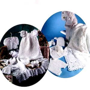 May include: Two sets of crocheted baby clothes in white. The first set includes a dress, a bonnet, a cardigan, and booties. The second set includes a hooded blanket, a pair of pants, a hat, and booties.