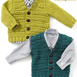 May include: Two knitted children's cardigans. One is a light green colour, and the other is a dark teal colour. Both have brown buttons and are layered over collared shirts with a small checked pattern.