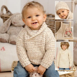 May include: A cream-colored knitted sweater with a wide collar for a baby. The sweater has a textured knit pattern and is shown on a baby wearing blue jeans.
