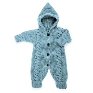 May include: A light blue knitted baby onesie with a hood and button closure. The onesie has a cable knit pattern.