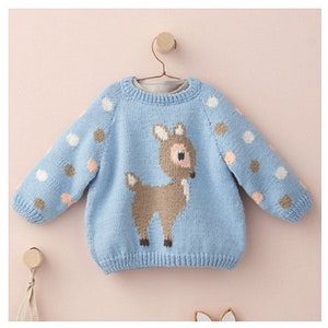 May include: A light blue knitted sweater with a brown deer design and white polka dots.