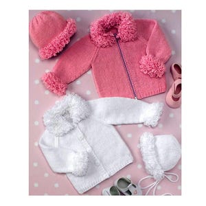 May include: Two knitted baby jackets with matching hats. One jacket is pink with a white fur trim and the other is white with a white fur trim. Both jackets have ruffled cuffs and collars.