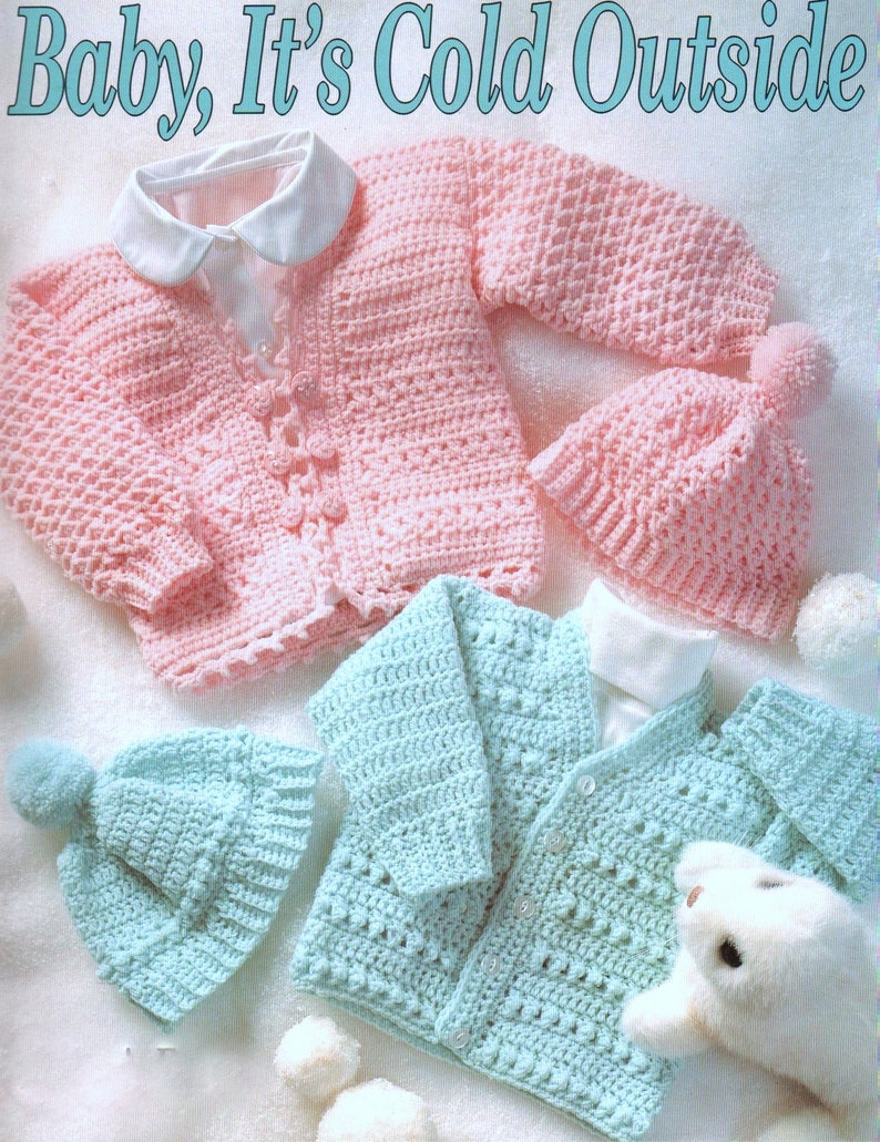 May include: Two crocheted baby cardigans, one pink and one blue, with matching crocheted hats. The cardigans have button closures and the hats have pom-poms.