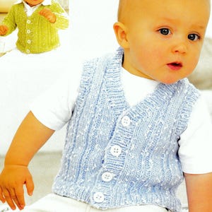 May include: A light blue knitted vest with white buttons and a V-neck. The vest has a textured pattern and is worn by a baby.