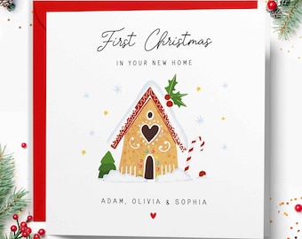 May include: A festive Christmas card with a red border. The card displays a gingerbread house illustration and the text "First Christmas in Your New Home." The names Adam, Olivia & Sophia are printed below the house.