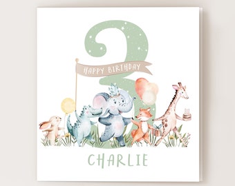 May include: A watercolor birthday card featuring a group of whimsical animals celebrating. The number 3 is in the background, with a banner that reads "Happy Birthday." The name "Charlie" is written below the animals.