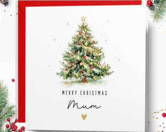 May include: A Christmas card featuring a watercolour illustration of a decorated Christmas tree. The card reads "MERRY CHRISTMAS Mum" with a gold heart. The card has a red border and festive decorations.