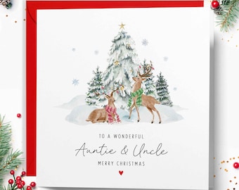 May include: Christmas card with a watercolour illustration of two deer in a snowy scene, with a decorated Christmas tree. The card reads "To a Wonderful Auntie & Uncle, Merry Christmas" with a red heart.