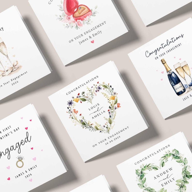 May include: A collection of engagement and congratulations cards. The cards feature watercolor illustrations of champagne, floral wreaths, and ring boxes. Text includes names, dates, and phrases like "On Your Engagement" and "Congratulations."