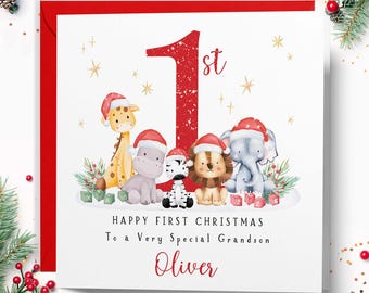 May include: A square greeting card featuring a large red number 1 and the text "Happy First Christmas To a Very Special Grandson Oliver". The design includes illustrations of a giraffe, hippo, zebra, lion, and elephant wearing Santa hats.