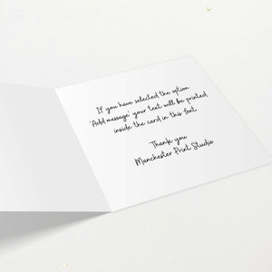 May include: An open white greeting card with black handwritten text. The text reads: "If you have selected the option 'Add message' your text will be printed inside the card in this font. Thank you Manchester Print Studio."