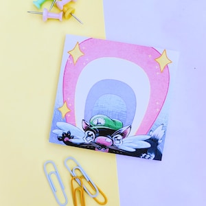 May include: A pink and white rainbow with a black and green cartoon animal with a green hat and white wings. The animal is looking at the viewer. The background is a light pink and yellow.