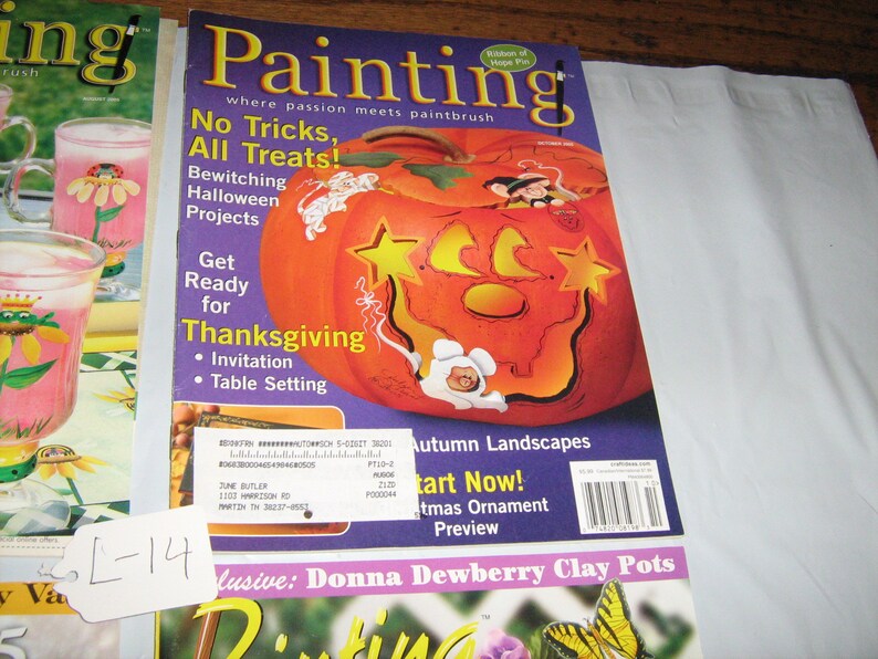 May include: A magazine cover featuring a painted pumpkin with a star and crescent moon design. The magazine is titled "Painting" and the cover text says "No Tricks, All Treats!" and "Get Ready for Thanksgiving".