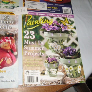 May include: Two craft magazines titled "Painting" and "25 Happy Gifts You Can Paint!" The "Painting" magazine features a cover image of three painted clay pots with flowers and butterflies. The "25 Happy Gifts" magazine features a cover image of a painted gourd with a red and white hat and a snowflake design.