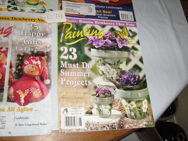 May include: Two craft magazines titled "Painting" and "25 Happy Gifts You Can Paint!" The "Painting" magazine features a cover image of three painted clay pots with flowers and butterflies. The "25 Happy Gifts" magazine features a cover image of a painted gourd with a red and white hat and a snowflake design.