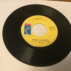 Booker T & the MG’S soul 45s on Stax # STA - 0013 ( hang ‘‘em high ) flip side is ( over easy )