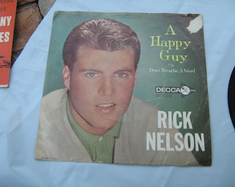 1960s rockabilly teen bopper Rick Nelson 45 rpm with picture sleeve ( a happy guy ) flip side ( don't breathe a word ) imperial # 31703