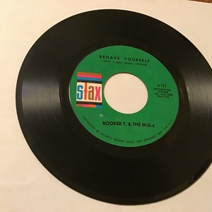 Booker T & the MG’S soul 45 rpm on Stax # S-127 ( green onions ) flip side is ( Behave yourself )
