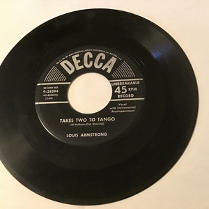Louis Armstrong (Jazz) on DECCA records 45 rpm # 9-28394 (I laughed at love) flip side is (takes two to tango)